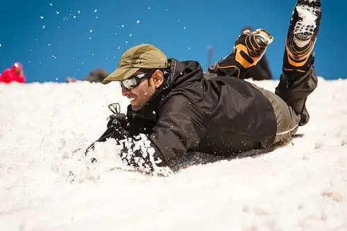 learning to slip properly on a slope or glacier with an ice ax