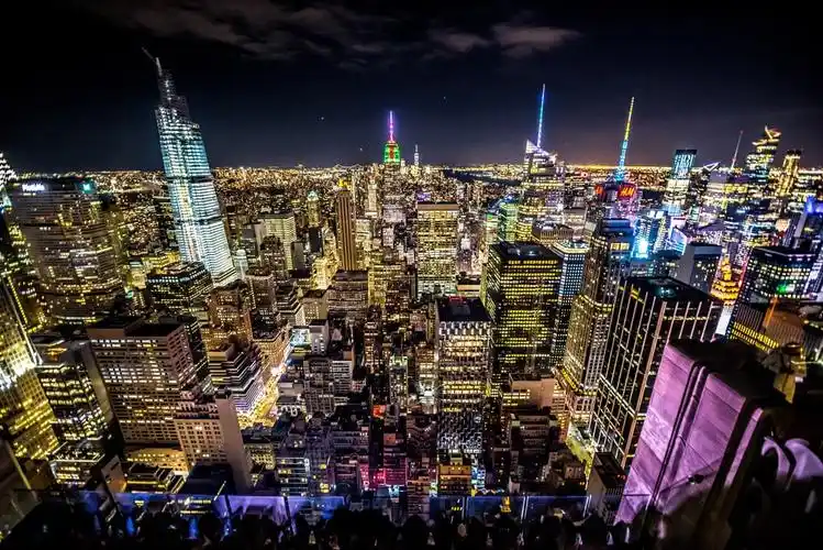 city with high rise buildings during night time