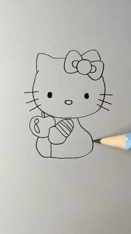 画一个彩色的凯蒂猫,坐着吃苹果的样子看起来特别的乖巧可爱