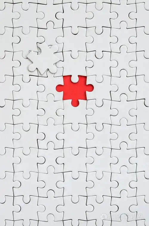 在一个缺少元素形成一个红色空间的装配状态下的白色拼图拼图的纹理