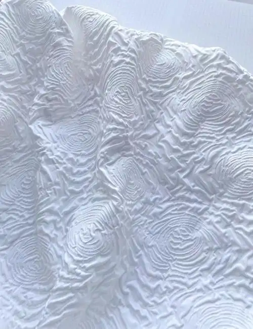 玫瑰肌理浮雕面料女装服装布料