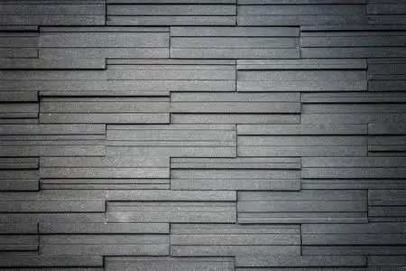 模式的灰色和粗糙的花岗岩墙纹理,背景照片