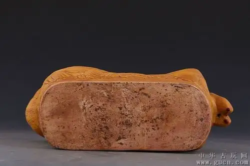 宋代定窑黄釉孩儿枕