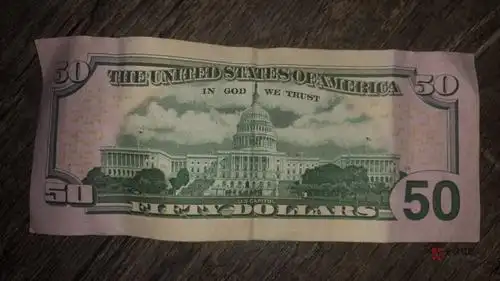 各位老哥家里有张50美元也不知道真的假的能去银行换人民币吗