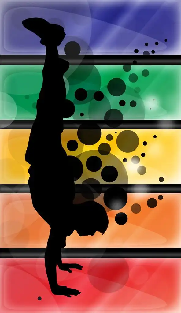 男孩的身影,黑色的人影的家伙做倒立 (彩色背景和黑色泡沫)