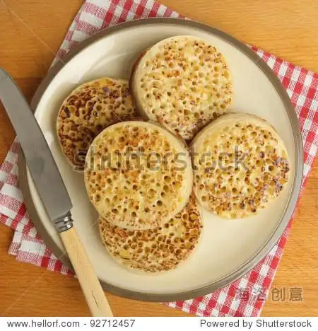 plate of hot buttered crumpets