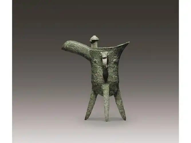 > 青铜饕餮纹爵杯