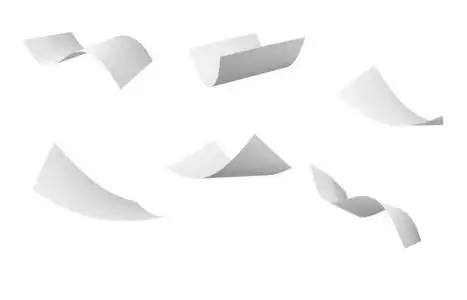 空白卷纸在风中飞照片