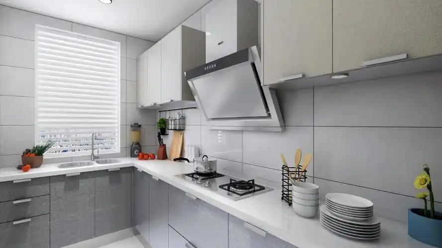 厨房采用灰色墙砖,高光柜门搭配浅色台面
