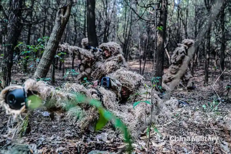 scouts engage mock targets in ghillie suits