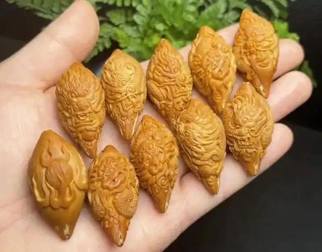 新手买橄榄核买什么题材好?|核雕|雕工|文玩圈_网易订阅