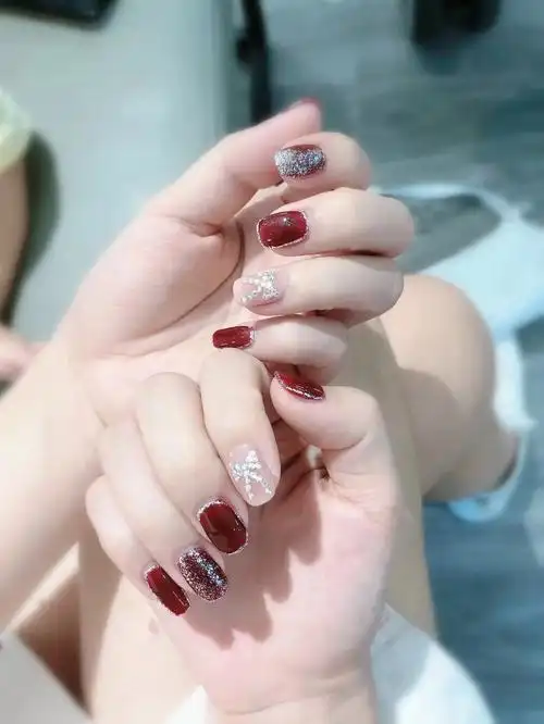 新娘美甲金边酒红蝴蝶结