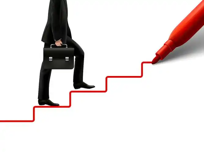 一个手提公文包的人在上台阶