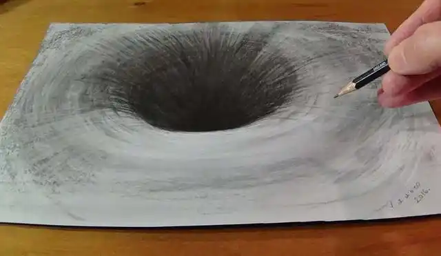 在纸上绘制一个超写实的黑洞(使用 秒拍 录制)