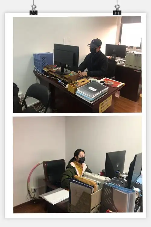 办公室员工都带好口罩认真上班