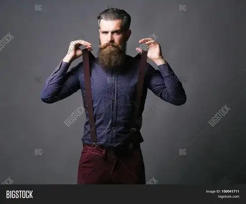 trendy man pulls suspenders 库存照片和库存图片 | bigstock