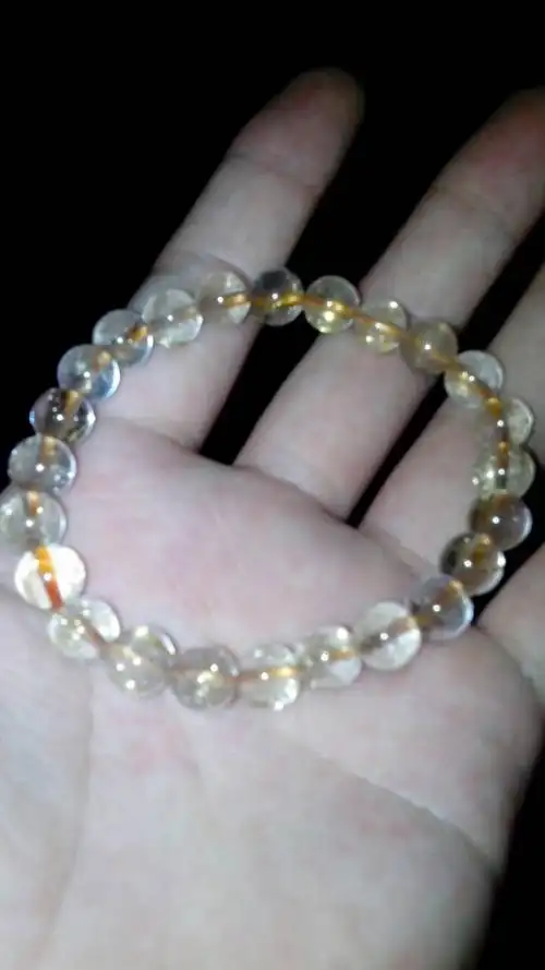 我在淘宝上买了一条钛晶,不知道是真是假的,请问如何辨别真假啊