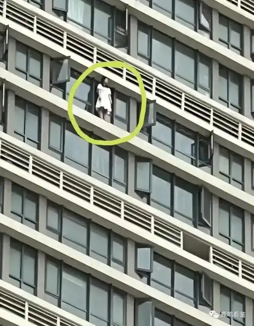 4月13日海口秀英大道一栋高楼上,一个身穿白色连衣裙的女子一跃而下