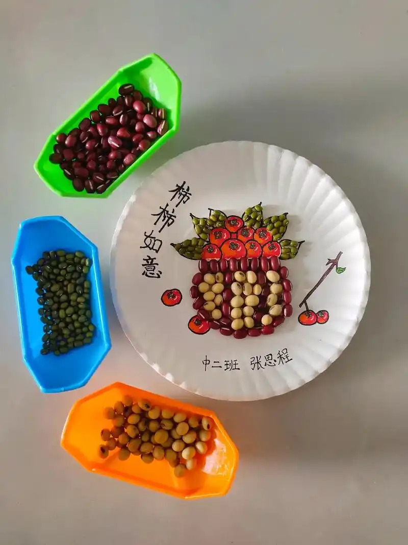 幼儿园手工作业,豆子粘贴画,柿柿如意.#粘贴画手工 - 抖音