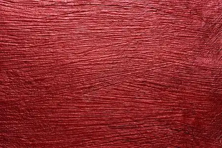 红色天鹅绒彩色纸纹理背景的照片背景图片