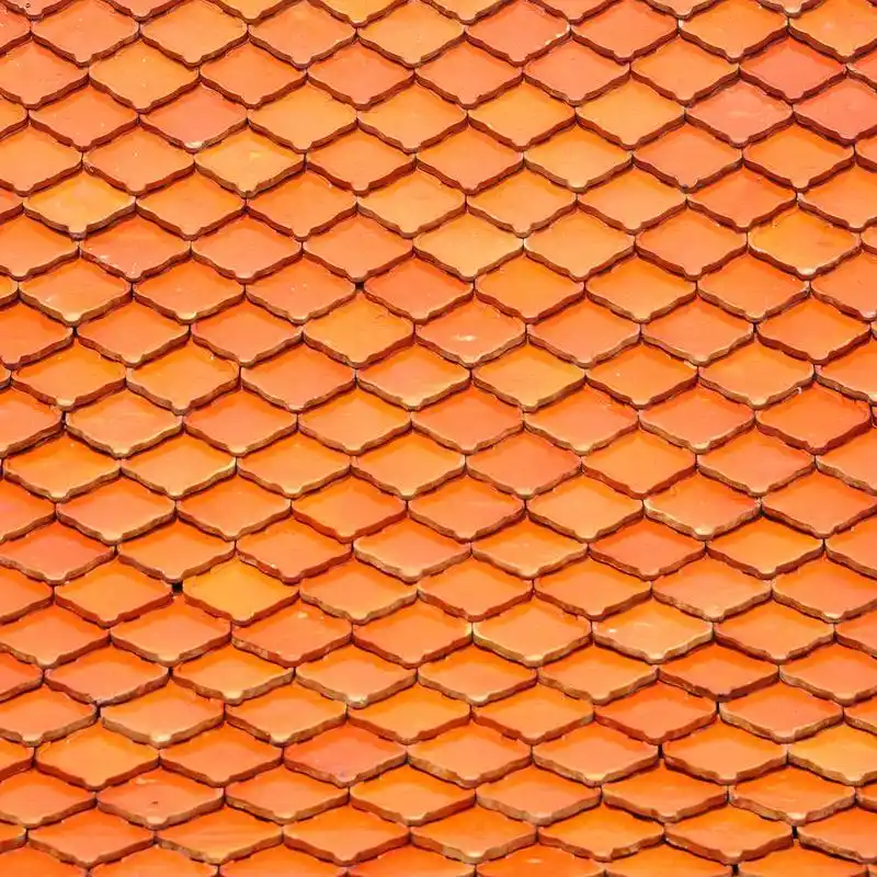 橙色屋顶瓦片,橘黄色的屋顶瓦片背景或纹理